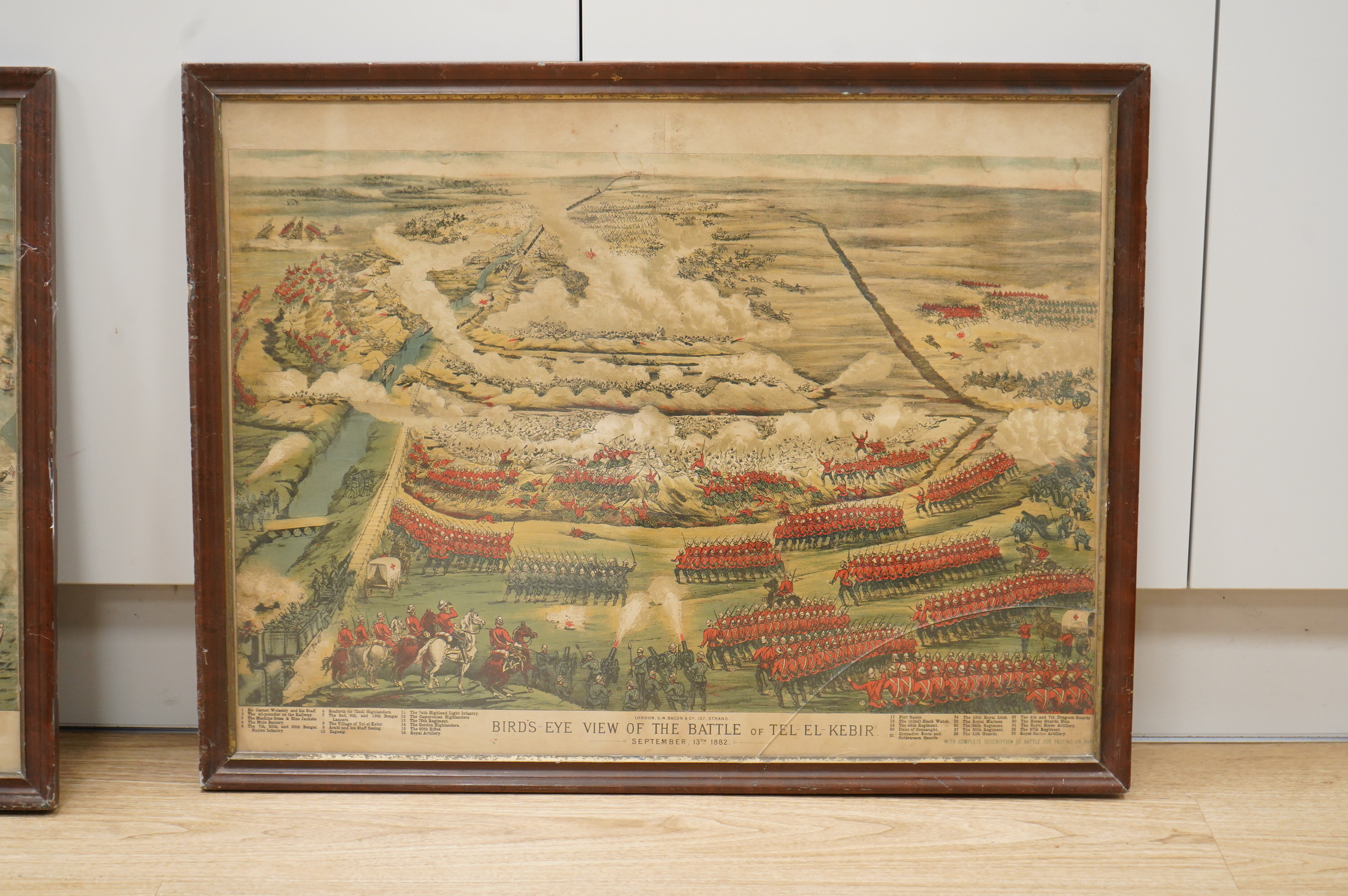 Two military interest chromolithographs comprising: 'The Bombardment of Alexandria' and 'Bird's eye view of the battle of Tel-El-Kebir', published G W Bacon, London, 53 x 70cm